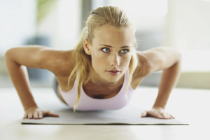 How does a girl learn to push up on the floor